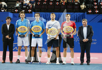2022-02-06 - Nicolas Mahut and Pierre-Hughes Herbert of France with the winners trophies and Lloyd Glasspool of Great Britain, Harri Heliovaara of Finland with the runner up trophies during the Double final at the Open Sud de Fance 2022, ATP 250 tennis tournament on February 6, 2022 at Sud de France Arena in Montpellier France - OPEN SUD DE FRANCE 2022, ATP 250 TENNIS TOURNAMENT - INTERNATIONALS - TENNIS