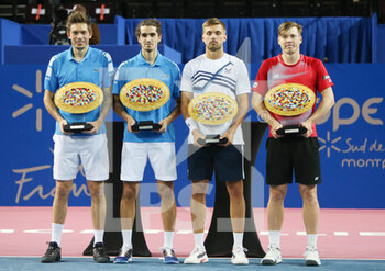2022-02-06 - Nicolas Mahut and Pierre-Hughes Herbert of France with the winners trophies and Lloyd Glasspool of Great Britain, Harri Heliovaara of Finland with the runner up trophies during the Double final at the Open Sud de Fance 2022, ATP 250 tennis tournament on February 6, 2022 at Sud de France Arena in Montpellier France - OPEN SUD DE FRANCE 2022, ATP 250 TENNIS TOURNAMENT - INTERNATIONALS - TENNIS