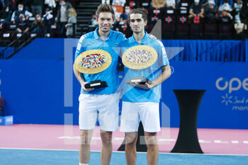 2022-02-06 - Nicolas Mahut and Pierre-Hughes Herbert of France celebrate with the winners trophies after winning the Double final of the Open Sud de Fance 2022, ATP 250 tennis tournament on February 6, 2022 at Sud de France Arena in Montpellier France - OPEN SUD DE FRANCE 2022, ATP 250 TENNIS TOURNAMENT - INTERNATIONALS - TENNIS