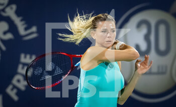2022-02-14 - Camila Giorgi of Italy in action against Petra Kvitova of the Czech Republic during the first round of the 2022 Dubai Duty Free Tennis Championships WTA 1000 tennis tournament on February 14, 2022 at The Aviation Club Tennis Centre in Dubai, UAE - 2022 DUBAI DUTY FREE TENNIS CHAMPIONSHIPS WTA 1000 TENNIS TOURNAMENT - INTERNATIONALS - TENNIS