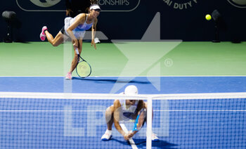 2022-02-17 - Ena Shibahara of Japan & Shuai Zhang of China in action during the doubles quarter-final of the 2022 Dubai Duty Free Tennis Championships WTA 1000 tennis tournament on February 17, 2022 at The Aviation Club Tennis Centre in Dubai, UAE - 2022 DUBAI DUTY FREE TENNIS CHAMPIONSHIPS WTA 1000 TENNIS TOURNAMENT - INTERNATIONALS - TENNIS