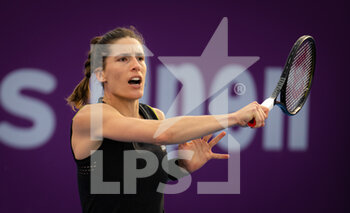 2022-02-21 - Andrea Petkovic of Germany in action against Viktorija Golubic of Switzerland during the first round of the 2022 Qatar TotalEnergies Open, WTA 1000 tennis tournament on February 21, 2022 at Khalifa tennis and squash complex in Doha, Qatar - 2022 QATAR TOTALENERGIES OPEN, WTA 1000 TENNIS TOURNAMENT - INTERNATIONALS - TENNIS