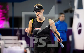 2022-02-21 - Angelique Kerber of Germany in action against Jil Teichmann of Switzerland during the first round of the 2022 Qatar TotalEnergies Open, WTA 1000 tennis tournament on February 21, 2022 at Khalifa tennis and squash complex in Doha, Qatar - 2022 QATAR TOTALENERGIES OPEN, WTA 1000 TENNIS TOURNAMENT - INTERNATIONALS - TENNIS