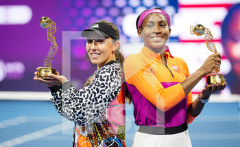 2022-02-25 - Cori Gauff of the United States & Jessica Pegula of the United States with their champions trophies after the doubles final of the 2022 Qatar TotalEnergies Open, WTA 1000 tennis tournament on February 25, 2022 at Khalifa tennis and squash complex in Doha, Qatar - 2022 QATAR TOTALENERGIES OPEN, WTA 1000 TENNIS TOURNAMENT - INTERNATIONALS - TENNIS