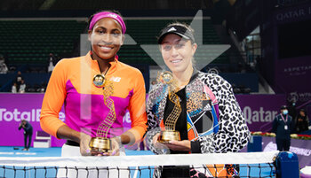 2022-02-25 - Cori Gauff of the United States & Jessica Pegula of the United States with their champions trophies after the doubles final of the 2022 Qatar TotalEnergies Open, WTA 1000 tennis tournament on February 25, 2022 at Khalifa tennis and squash complex in Doha, Qatar - 2022 QATAR TOTALENERGIES OPEN, WTA 1000 TENNIS TOURNAMENT - INTERNATIONALS - TENNIS