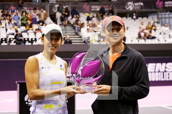 2022-03-06 - Zhang Shuai (CHN) and Coach of Zhang Shuai celebrate with the trophy after winning against Dayana Yastremska (UKR) during the final of the Open 6ème Sens, Métropole de Lyon 2022, WTA 250 tennis tournament on March 6, 2022 at Palais des Sports de Gerland in Lyon, France - OPEN 6èME SENS, MéTROPOLE DE LYON 2022, WTA 250 TENNIS TOURNAMENT - INTERNATIONALS - TENNIS
