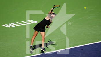 2022-03-13 - Clara Tauson of Denmark in action against Iga Swiatek of Poland during the third round of the 2022 BNP Paribas Open, WTA 1000 tennis tournament on March 13, 2022 at Indian Wells Tennis Garden in Indian Wells, USA - 2022 BNP PARIBAS OPEN, WTA 1000 TENNIS TOURNAMENT - INTERNATIONALS - TENNIS