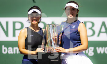 2022-03-19 - Yifan Xu of China & Zhaoxuan Yang of China pose with the champions trophy after the doubles final of the 2022 BNP Paribas Open, WTA 1000 tennis tournament on March 19, 2022 at Indian Wells Tennis Garden in Indian Wells, USA - 2022 BNP PARIBAS OPEN, WTA 1000 TENNIS TOURNAMENT - INTERNATIONALS - TENNIS