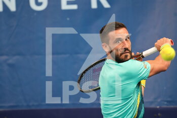 2022-03-22 - Damir Dzumhur during the Play In Challenger 2022, ATP Challenger Tour tennis tournament on March 22, 2022 at Tennis Club Lillois Lille Metropole in Lille, France - PLAY IN CHALLENGER 2022, ATP CHALLENGER TOUR TENNIS TOURNAMENT - INTERNATIONALS - TENNIS