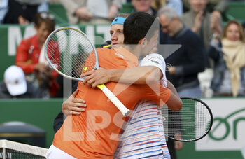 2022-04-12 - Alejandro Davidovich Fokina of Spain hugs Novak Djokovic of Serbia (left) after his second round victory during day 3 of the Rolex Monte-Carlo Masters 2022, an ATP Masters 1000 tennis tournament on April 12, 2022, held at the Monte-Carlo Country Club in Roquebrune-Cap-Martin, France - ROLEX MONTE-CARLO MASTERS 2022, ATP MASTERS 1000 TENNIS TOURNAMENT - INTERNATIONALS - TENNIS