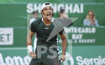 2022-04-13 - Lorenzo Musetti of Italia celebrates his victory over Felix Auger-Aliassime of Canada during day 4 of the Rolex Monte-Carlo Masters 2022, an ATP Masters 1000 tennis tournament on April 13, 2022, held at the Monte-Carlo Country Club in Roquebrune-Cap-Martin, France - ROLEX MONTE-CARLO MASTERS 2022, ATP MASTERS 1000 TENNIS TOURNAMENT - INTERNATIONALS - TENNIS