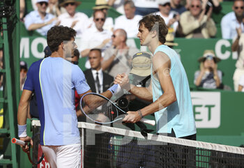 2022-04-14 - Alexander Zverev of Germany shakes hands with Pablo Carremo Busta of Spain (left) after his victory during day 5 of the Rolex Monte-Carlo Masters 2022, an ATP Masters 1000 tennis tournament on April 14, 2022, held at the Monte-Carlo Country Club in Roquebrune-Cap-Martin, France - ROLEX MONTE-CARLO MASTERS 2022, ATP MASTERS 1000 TENNIS TOURNAMENT - INTERNATIONALS - TENNIS