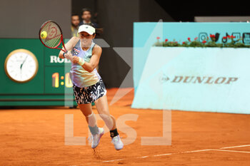 2022-04-26 - Misaki Doi of Japan in action against Andrea Petkovic of Germany during qualifying at the Mutua Madrid Open 2022 tennis tournament on April 26, 2022 at Caja Magica stadium in Madrid, Spain - MUTUA MADRID OPEN 2022 TENNIS TOURNAMENT - INTERNATIONALS - TENNIS