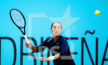 2022-04-28 - Qinwen Zheng of China in action against Karolina Muchova of the Czech Republic during the first round of the Mutua Madrid Open 2022 tennis tournament on April 28, 2022 at Caja Magica stadium in Madrid, Spain - MUTUA MADRID OPEN 2022 TENNIS TOURNAMENT - INTERNATIONALS - TENNIS