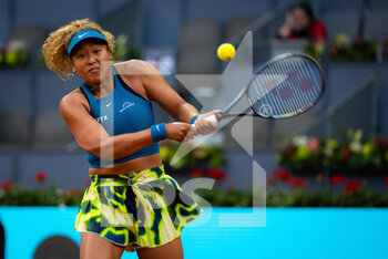 2022-05-01 - Naomi Osaka of Japan in action against Sara Sorribes Tormo of Spain during the second round of the Mutua Madrid Open 2022 tennis tournament on May 1, 2022 at Caja Magica stadium in Madrid, Spain - MUTUA MADRID OPEN 2022 TENNIS TOURNAMENT - INTERNATIONALS - TENNIS