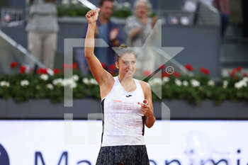 2022-05-01 - Sara Sorribes of Spain reacts after winning against Naomi Osaka of Japan during the Mutua Madrid Open 2022 tennis tournament on May 1, 2022 at Caja Magica stadium in Madrid, Spain - MUTUA MADRID OPEN 2022 TENNIS TOURNAMENT - INTERNATIONALS - TENNIS