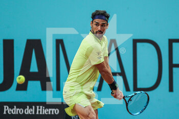 2022-05-01 - Fabio Fognini from Italy in action against Nikoloz Basilashvili from Georgia during the Mutua Madrid Open 2022 tennis tournament on May 2, 2022 at Caja Magica stadium in Madrid, Spain - MUTUA MADRID OPEN 2022 TENNIS TOURNAMENT - INTERNATIONALS - TENNIS