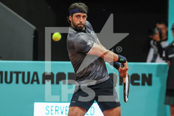 2022-05-01 - Nikoloz Basilashvili from Georgia in action against Fabio Fognini from Italy during the Mutua Madrid Open 2022 tennis tournament on May 2, 2022 at Caja Magica stadium in Madrid, Spain - MUTUA MADRID OPEN 2022 TENNIS TOURNAMENT - INTERNATIONALS - TENNIS