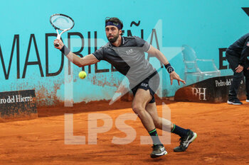 2022-05-01 - Nikoloz Basilashvili from Georgia in action against Fabio Fognini from Italy during the Mutua Madrid Open 2022 tennis tournament on May 2, 2022 at Caja Magica stadium in Madrid, Spain - MUTUA MADRID OPEN 2022 TENNIS TOURNAMENT - INTERNATIONALS - TENNIS