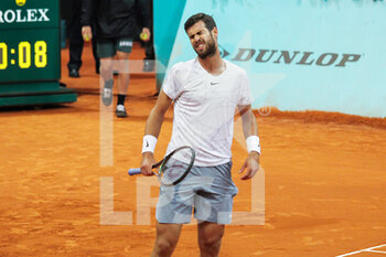 2022-05-02 - Karen Khachanov from Russia in action against Lucas Pouille from France during the Mutua Madrid Open 2022 tennis tournament on May 2, 2022 at Caja Magica stadium in Madrid, Spain - MUTUA MADRID OPEN 2022 TENNIS TOURNAMENT - INTERNATIONALS - TENNIS