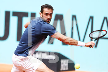 2022-05-03 - Marin Cilic of Croatia in action against Albert Ramos of Spain during the Mutua Madrid Open 2022 tennis tournament on May 3, 2022 at Caja Magica stadium in Madrid, Spain - MUTUA MADRID OPEN 2022 TENNIS TOURNAMENT - INTERNATIONALS - TENNIS