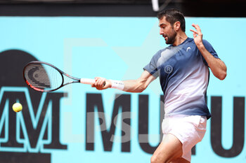2022-05-03 - Marin Cilic of Croatia in action against Albert Ramos of Spain during the Mutua Madrid Open 2022 tennis tournament on May 3, 2022 at Caja Magica stadium in Madrid, Spain - MUTUA MADRID OPEN 2022 TENNIS TOURNAMENT - INTERNATIONALS - TENNIS