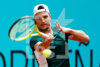 2022-05-03 - Miomir Kecmanovic from Serbia in action against Alexander Bublik of Kazakhstan during the Mutua Madrid Open 2022 tennis tournament on May 3, 2022 at Caja Magica stadium in Madrid, Spain - MUTUA MADRID OPEN 2022 TENNIS TOURNAMENT - INTERNATIONALS - TENNIS
