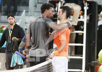 2022-05-03 - Novak Djokovic of Serbia and Gael Monfils of France during the Mutua Madrid Open 2022 tennis tournament on May 3, 2022 at Caja Magica stadium in Madrid, Spain - MUTUA MADRID OPEN 2022 TENNIS TOURNAMENT - INTERNATIONALS - TENNIS