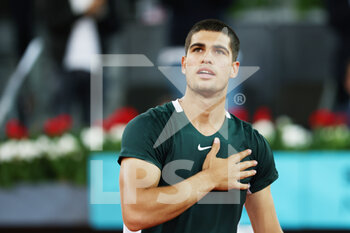 2022-05-03 - Carlos Alcaraz of Spain reacts after winning against Nikoloz Basilashvili of Georgia during the Mutua Madrid Open 2022 tennis tournament on May 3, 2022 at Caja Magica stadium in Madrid, Spain - MUTUA MADRID OPEN 2022 TENNIS TOURNAMENT - INTERNATIONALS - TENNIS
