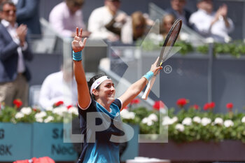 2022-05-04 - Ons Jabeur of Tunisia reacts after winning against Simona Halep of Romania during the Mutua Madrid Open 2022 tennis tournament on May 4, 2022 at Caja Magica stadium in Madrid, Spain - MUTUA MADRID OPEN 2022 TENNIS TOURNAMENT - INTERNATIONALS - TENNIS