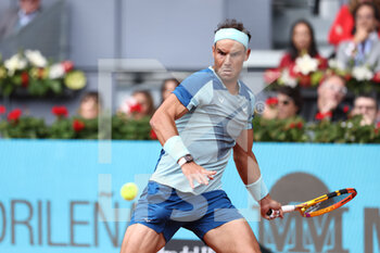 2022-05-04 - Rafael Nadal of Spain in action against Miomir Kecmanovic of Serbia during the Mutua Madrid Open 2022 tennis tournament on May 4, 2022 at Caja Magica stadium in Madrid, Spain - MUTUA MADRID OPEN 2022 TENNIS TOURNAMENT - INTERNATIONALS - TENNIS