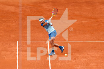 2022-05-04 - Rafael Nadal of Spain in action against Miomir Kecmanovic of Serbia during the Mutua Madrid Open 2022 tennis tournament on May 4, 2022 at Caja Magica stadium in Madrid, Spain - MUTUA MADRID OPEN 2022 TENNIS TOURNAMENT - INTERNATIONALS - TENNIS