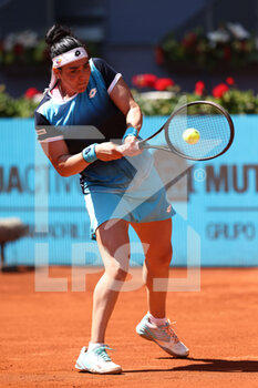 2022-05-05 - Ons Jabeur of Tunisia in action against Ekaterina Alexandrova of Russia during the Mutua Madrid Open 2022 tennis tournament on May 5, 2022 at Caja Magica stadium in Madrid, Spain - MUTUA MADRID OPEN 2022 TENNIS TOURNAMENT - INTERNATIONALS - TENNIS