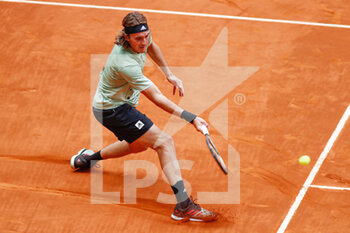2022-05-05 - Stefanos Tsitsipas of Greece in action against Gigror Dimitrov of Bulgaria during the Mutua Madrid Open 2022 tennis tournament on May 5, 2022 at Caja Magica stadium in Madrid, Spain - MUTUA MADRID OPEN 2022 TENNIS TOURNAMENT - INTERNATIONALS - TENNIS