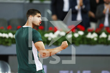 2022-05-05 - Carlos Alcaraz of Spain reacts after winning against Cameron Norrie of Great Britain during the Mutua Madrid Open 2022 tennis tournament on May 5, 2022 at Caja Magica stadium in Madrid, Spain - MUTUA MADRID OPEN 2022 TENNIS TOURNAMENT - INTERNATIONALS - TENNIS