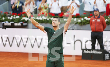 2022-05-07 - Carlos Alcaraz of Spain reacts after winning against Novak Djokovic of Croatia during the Mutua Madrid Open 2022 tennis tournament on May 7, 2022 at Caja Magica stadium in Madrid, Spain - MUTUA MADRID OPEN 2022 TENNIS TOURNAMENT - INTERNATIONALS - TENNIS