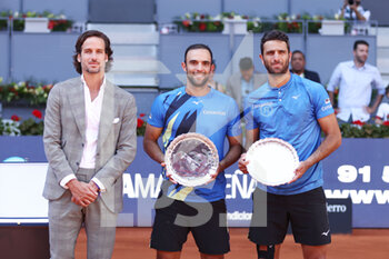 2022-05-08 - Juan Sebastian Cabal and Robert Farah of Colombia pose with Feliciano Lopez and second place trophy after losing against Wesley Koolhof of The Netherlands and Neal Skupski of Great Britain, Final ATP doubles match during the Mutua Madrid Open 2022 tennis tournament on May 8, 2022 at Caja Magica stadium in Madrid, Spain - MUTUA MADRID OPEN 2022 TENNIS TOURNAMENT - INTERNATIONALS - TENNIS