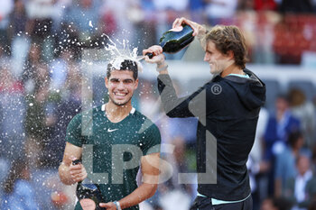 2022-05-08 - Carlos Alcaraz of Spain (winner) and Alexander Zverev of Germany (second place) celebrate, Men's Final during the Mutua Madrid Open 2022 tennis tournament on May 8, 2022 at Caja Magica stadium in Madrid, Spain - MUTUA MADRID OPEN 2022 TENNIS TOURNAMENT - INTERNATIONALS - TENNIS