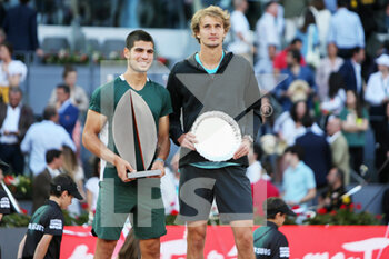 2022-05-08 - Carlos Alcaraz of Spain with the champion trophy and Alexander Zverev of Germany with the runner up trophy, Final Men's ATP match during the Mutua Madrid Open 2022 tennis tournament on May 8, 2022 at Caja Magica stadium in Madrid, Spain - MUTUA MADRID OPEN 2022 TENNIS TOURNAMENT - INTERNATIONALS - TENNIS