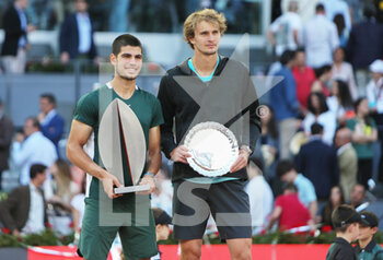 2022-05-08 - Carlos Alcaraz of Spain with the champion trophy and Alexander Zverev of Germany with the runner up trophy, Final Men's ATP match during the Mutua Madrid Open 2022 tennis tournament on May 8, 2022 at Caja Magica stadium in Madrid, Spain - MUTUA MADRID OPEN 2022 TENNIS TOURNAMENT - INTERNATIONALS - TENNIS