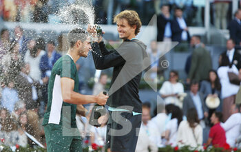 2022-05-08 - Carlos Alcaraz of Spain (winner) and Alexander Zverev of Germany (second place) celebrate, Final Men's ATP match during the Mutua Madrid Open 2022 tennis tournament on May 8, 2022 at Caja Magica stadium in Madrid, Spain - MUTUA MADRID OPEN 2022 TENNIS TOURNAMENT - INTERNATIONALS - TENNIS