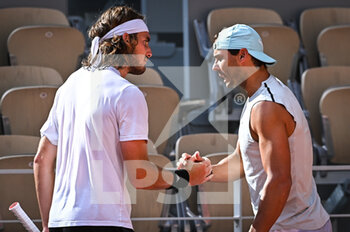 2022-05-18 - Stefanos TSITSIPAS of Greece and Rafael NADAL of Spain during a training session of Roland-Garros 2022, French Open 2022, Grand Slam tennis tournament on May 18, 2022 at the Roland-Garros stadium in Paris, France - ROLAND-GARROS 2022, FRENCH OPEN 2022, GRAND SLAM TENNIS TOURNAMEN - INTERNATIONALS - TENNIS