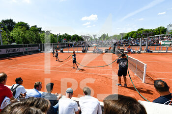 2022-05-19 - General view with a clay court (annex) being watered during the French Open (Roland-Garros) 2022, Grand Slam tennis tournament on May 19, 2022 at Roland-Garros stadium in Paris, France - FRENCH OPEN (ROLAND-GARROS) 2022, GRAND SLAM TENNIS TOURNAMENT - INTERNATIONALS - TENNIS
