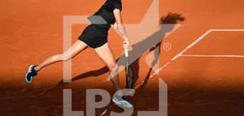 2022-05-19 - Illustration picture shows the lower body of a female (woman) player after a serve on a clay court during the French Open (Roland-Garros) 2022, Grand Slam tennis tournament on May 19, 2022 at Roland-Garros stadium in Paris, France - FRENCH OPEN (ROLAND-GARROS) 2022, GRAND SLAM TENNIS TOURNAMENT - INTERNATIONALS - TENNIS