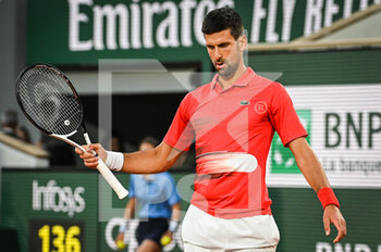 2022-05-23 - Novak DJOKOVIC of Serbia looks dejected during the Day two of Roland-Garros 2022, French Open 2022, Grand Slam tennis tournament on May 23, 2022 at Roland-Garros stadium in Paris, France - ROLAND-GARROS 2022, FRENCH OPEN 2022, GRAND SLAM TENNIS TOURNAMENT - INTERNATIONALS - TENNIS