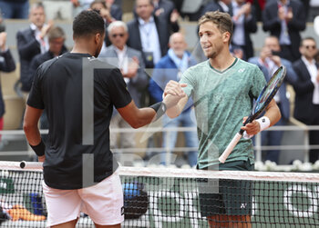2022-05-24 - Jo-Wilfried Tsonga of France shakes hands with Casper Ruud of Norway after his defeat for his last match of his career on day 3 of the French Open 2022, a tennis Grand Slam tournament on May 24, 2022 at Roland-Garros stadium in Paris, France - ROLAND-GARROS 2022, FRENCH OPEN 2022, GRAND SLAM TENNIS TOURNAMENT - INTERNATIONALS - TENNIS