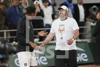 2022-05-24 - Jo-Wilfried Tsonga of France, his coach Thierry Ascione during a ceremony celebrating his career after his last tennis match against Casper Ruud of Norway on day 3 of the French Open 2022, a tennis Grand Slam tournament on May 24, 2022 at Roland-Garros stadium in Paris, France - ROLAND-GARROS 2022, FRENCH OPEN 2022, GRAND SLAM TENNIS TOURNAMENT - INTERNATIONALS - TENNIS
