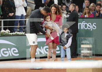 2022-05-24 - Jo-Wilfried Tsonga of France, his wife Noura Tsonga and their sons during a ceremony celebrating his career after his last tennis match against Casper Ruud of Norway on day 3 of the French Open 2022, a tennis Grand Slam tournament on May 24, 2022 at Roland-Garros stadium in Paris, France - ROLAND-GARROS 2022, FRENCH OPEN 2022, GRAND SLAM TENNIS TOURNAMENT - INTERNATIONALS - TENNIS