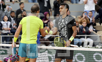 2022-05-29 - Rafael Nadal of Spain shakes hands with Felix Auger-Aliassime of Canada after his victory during day 8 of the French Open 2022, Roland-Garros 2022, second Grand Slam tennis tournament of the season on May 29, 2022 at Roland-Garros stadium in Paris, France - TENNIS - ROLAND GARROS 2022 - WEEK 1 PART 2 - INTERNATIONALS - TENNIS