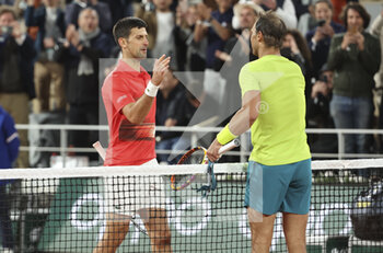 2022-05-31 - Rafael Nadal of Spain shakes hands with Novak Djokovic of Serbia (left) after his victory during day 10 of Roland-Garros 2022, French Open 2022, second Grand Slam tennis tournament of the season on May 31, 2022 at Roland-Garros stadium in Paris, France - TENNIS - ROLAND GARROS 2022 - WEEK 2 - INTERNATIONALS - TENNIS